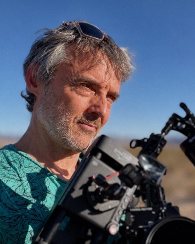 Heath Cozens behind a camera rig in the desert
